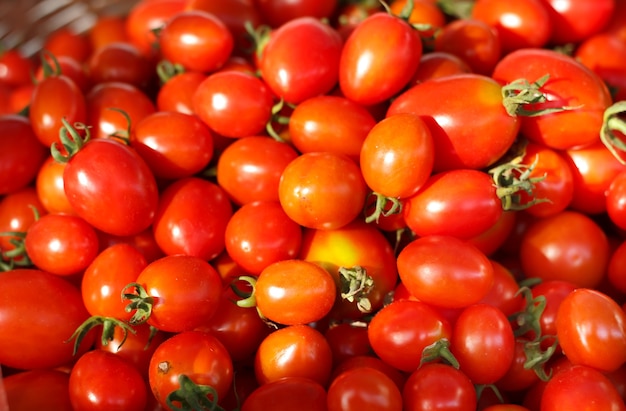 Group of fresh tomatoes in basket.