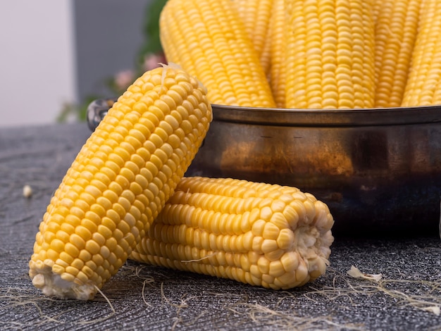 Group freshness seeds of sweet corn in a pot on the table.