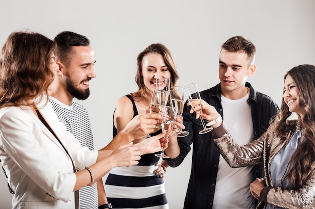 A group of friends are having fun and drinking champagne. Party atmosphere