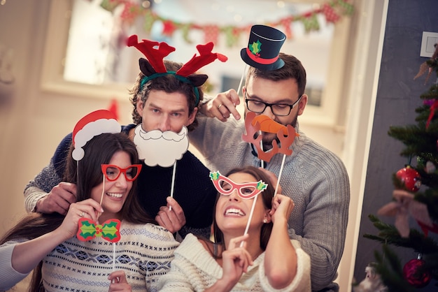 group of friends celebrating Christmas at home