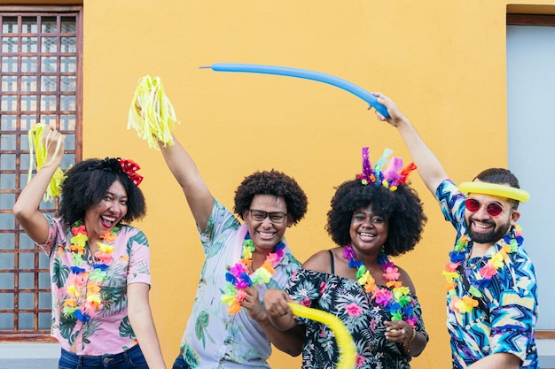 Group of friends celebrating street carnival