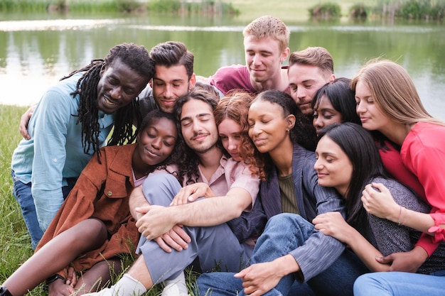 Group of friends doing relaxation exercises outdoors and sharing moments