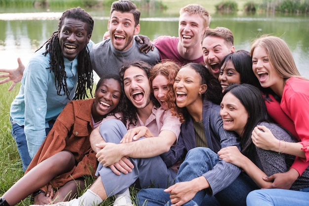 Group of friends from different cultures shouting and with funny faces having a joyful time