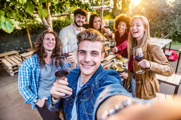 Group of friends having barbeque dinner party