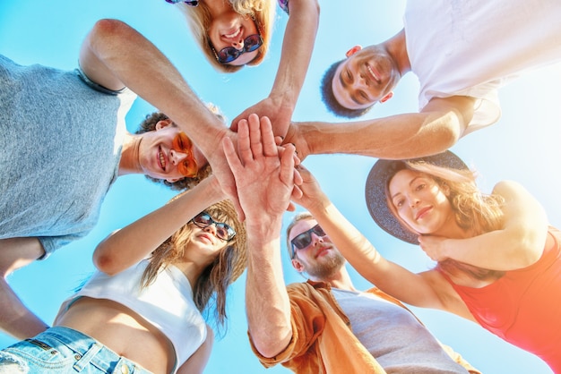 Group of friends having fun on the beach