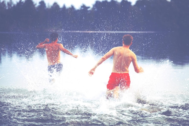 Group of friends having fun on the beach