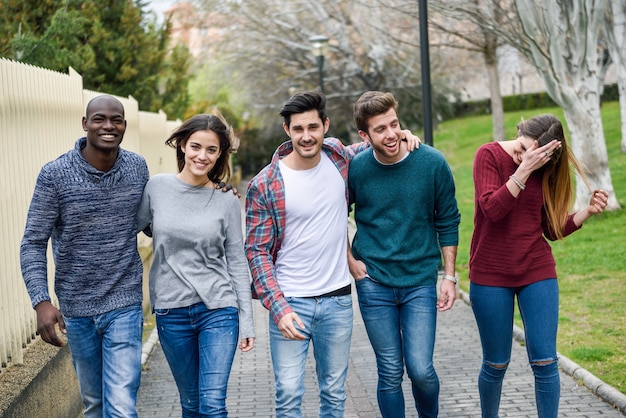 Group of friends having fun together outdoors