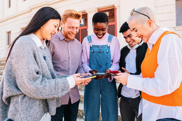 Group of friends having fun with smartphones browsing in social media