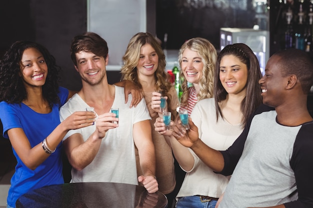 Group of friends having shots