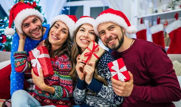 group of friends at home on Christmas time