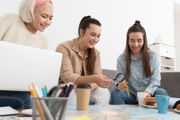 Group of friends planning a trip with a map