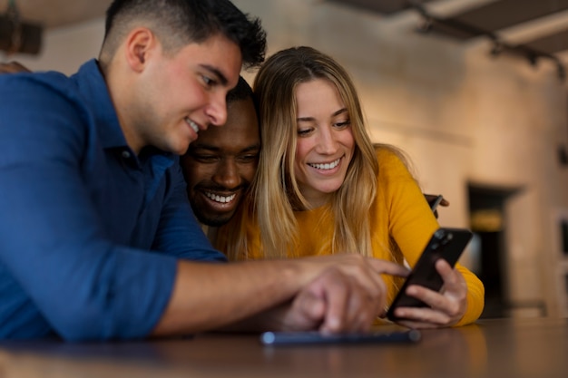 Group of friends reading cell phone messages