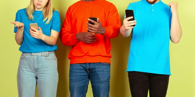 Group of friends using mobile smartphones