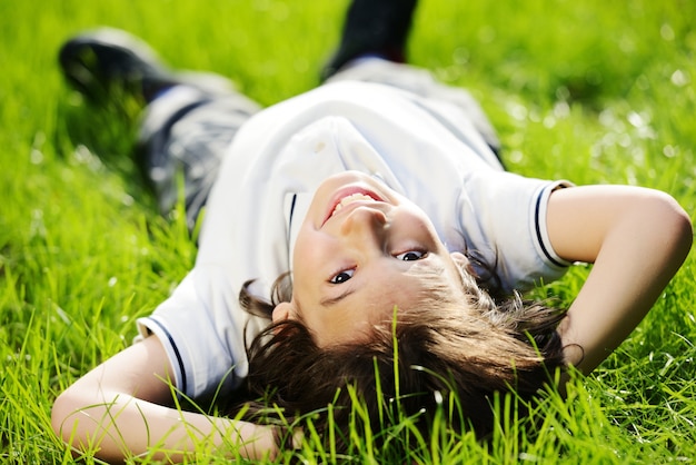 Group of happy children playing outdoors in spring park