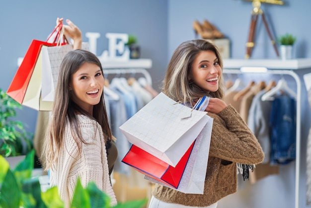 Group of happy friends during shopping. High quality photo