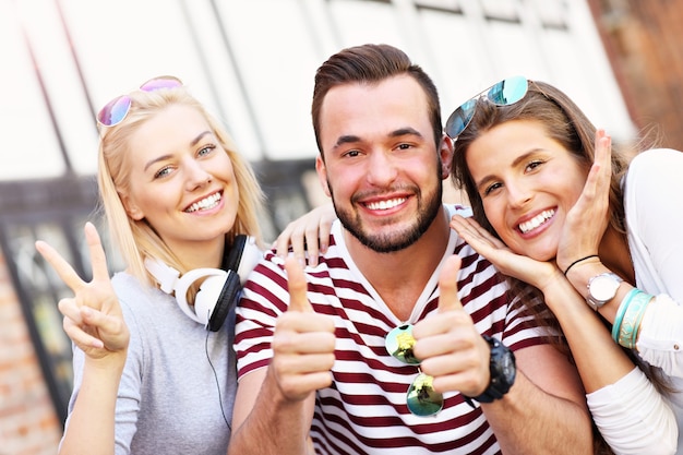 group of happy friends smiling to the camera