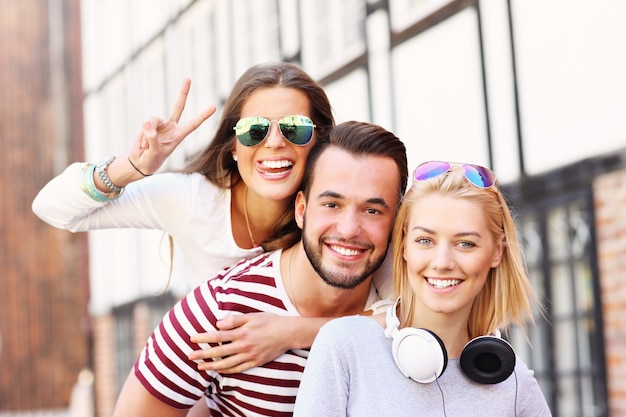 group of happy friends smiling to the camera