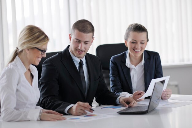 Group of happy young  business people in a meeting at office