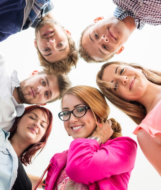 Group of happy young people in circle