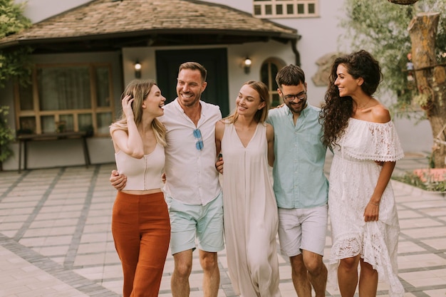 Group of happy young people having fun outdoors