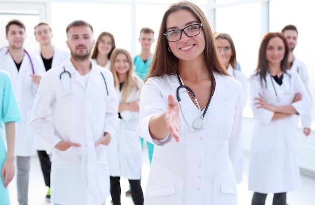 Group of happy young people pointing at you