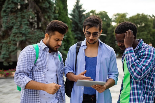 The group of indian students help your classmate with navigation