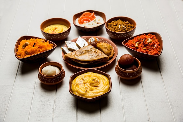 Group of Indian Sweet or mithai in terracotta bowl, selective focus