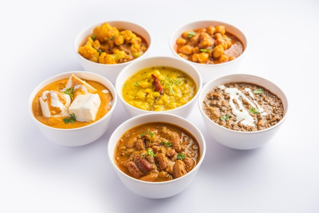 Group of Indian vegetarian dishes hot and spicy Punjabi cuisine meal assortment in bowls