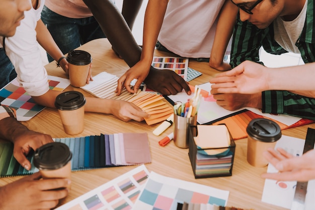 Group of Interracial Designers is Works in Office