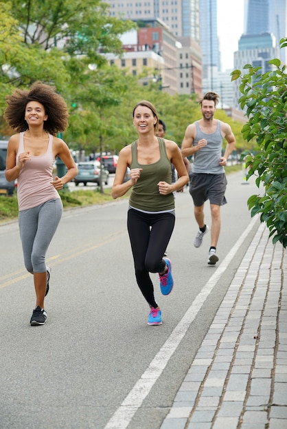 Group of joggers exercising in Manhattan running track 