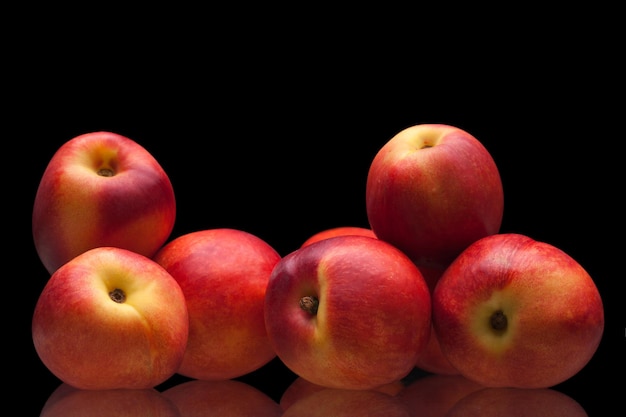 Group of juicy peaches lying isolated