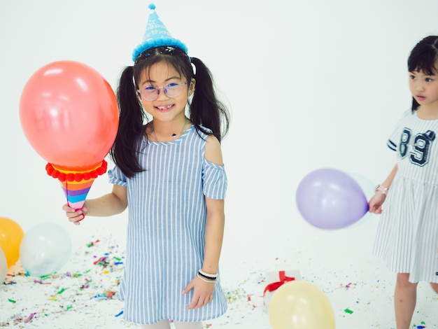 Group of kids celebrate party and enjoy christmas fun together