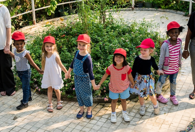 Group of kids school field trips learning outdoors botanic park