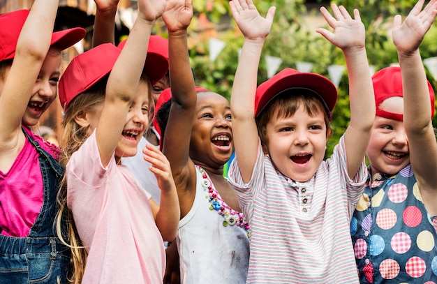 Photo group of kids school friends hand raised happiness smiling learning