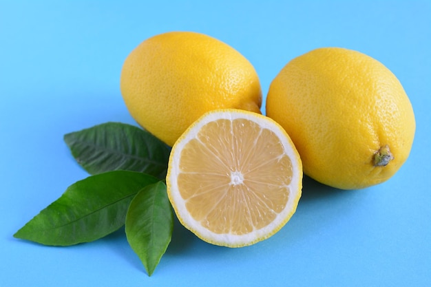 group of lemons on the blue background, close-up