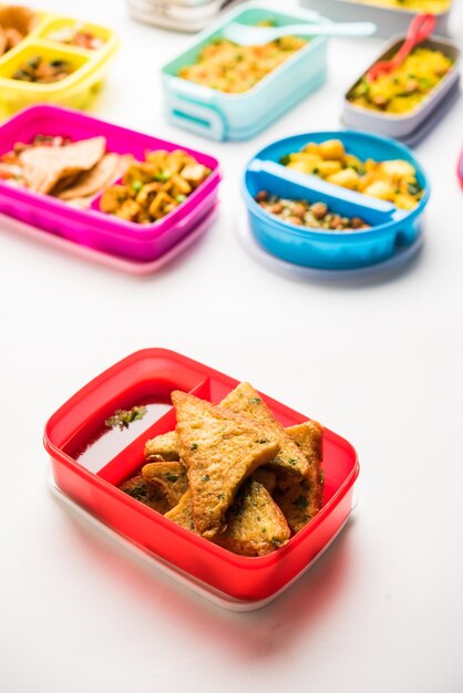 Group of Lunch Box or Tiffin for Indian kids, showing variety or multiple option or combination of healthy food for your school going children