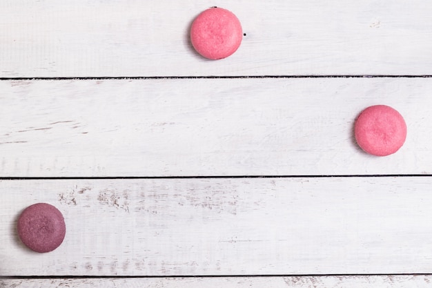 Group of macarons made of strawberries, cream, chocolate and blueberries. 