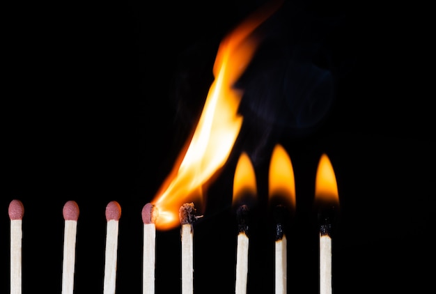 Group Of Matches Lit In Row Burning