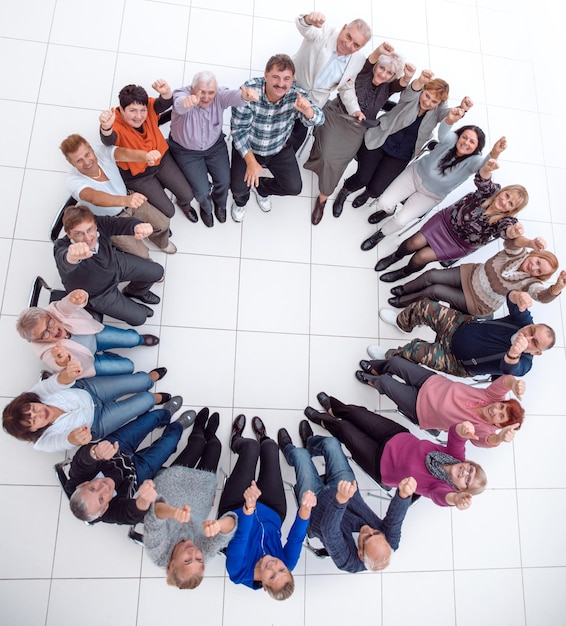 Group of mature people applauding sitting in a circle