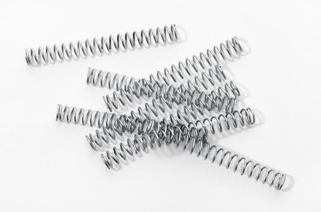 Group of metallic coil springs isolated on white background