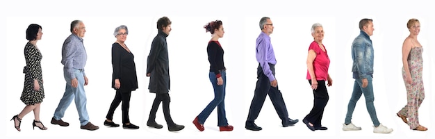 Group of mixed people walking on white