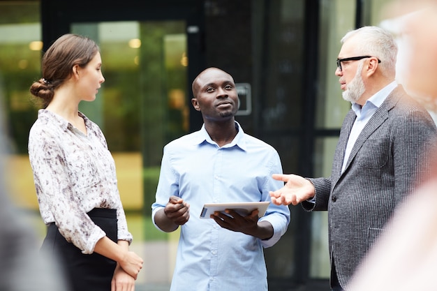 Group of Modern Business People Discussing Work Outdoors