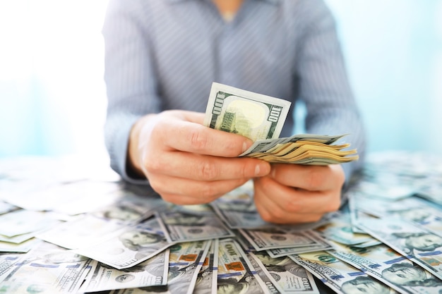 Group of money stack of 100 US dollars banknotes a lot of the background texture. Cash money in a large pile as a finance background.