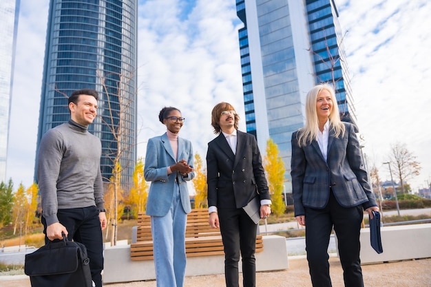 Group of multiethnic businessmen and businesswomen talking about work in a business park