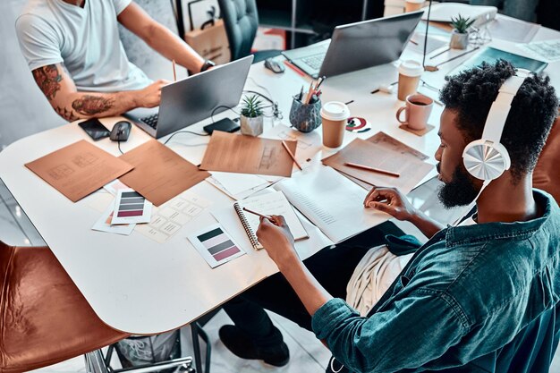 Group of multiethnic busy people working in an office High angle shot