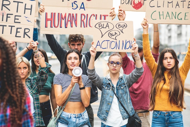 Photo group of multiethnic people making protest about climate change public demonstration on the street against global warming and pollution