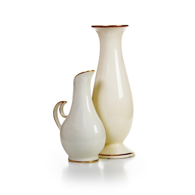 Group of old white porcelain vases on white background