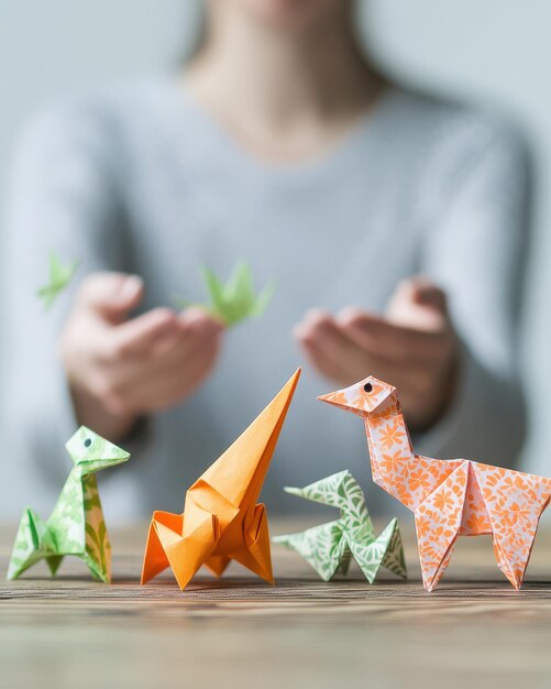 Photo a group of paper animals that are made by a woman