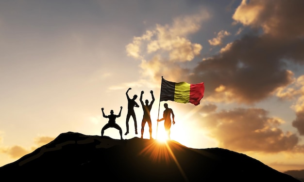 A group of people celebrate on a mountain top with belgium flag d render