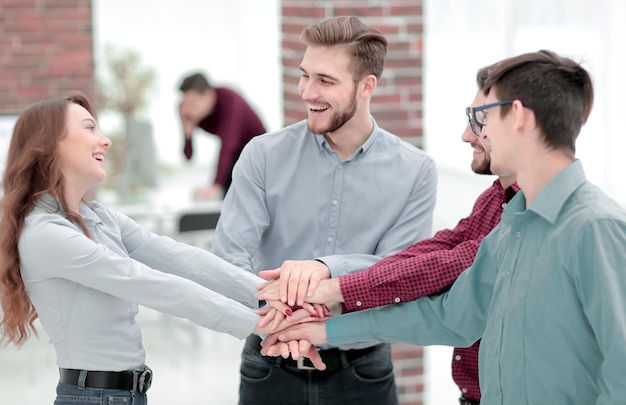 Photo group of people hands together partnership teamwork